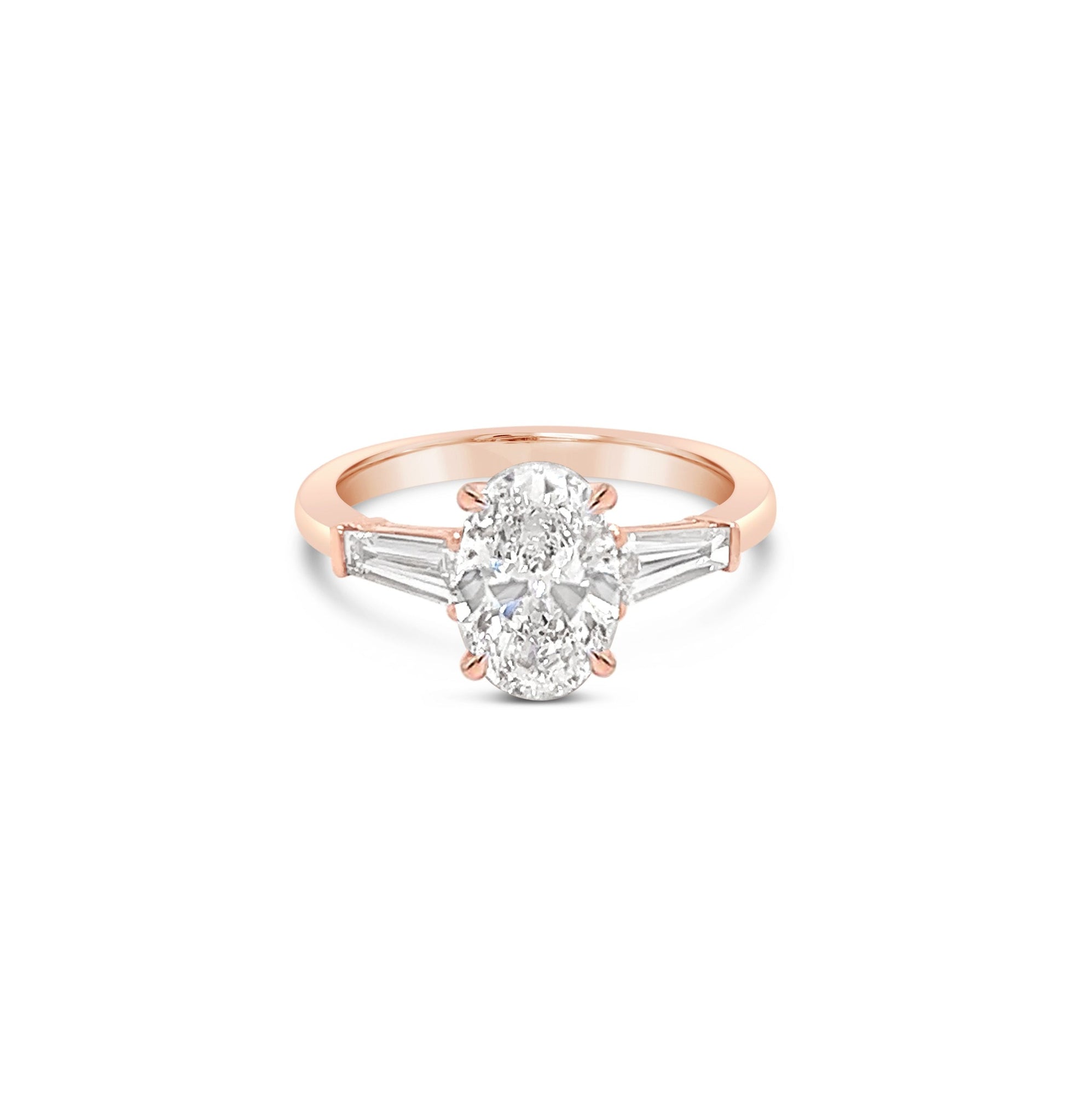 Oval and Tapered Baguette Diamond Three Stone Ring